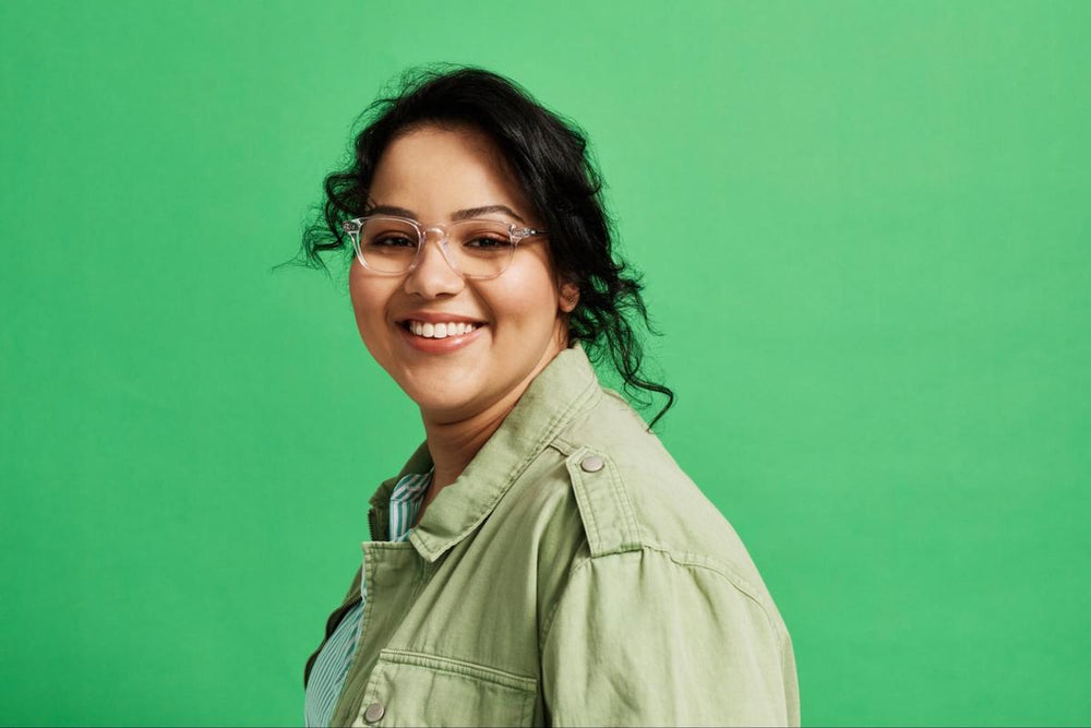 Best glasses for round face: woman smiling and looking at the camera